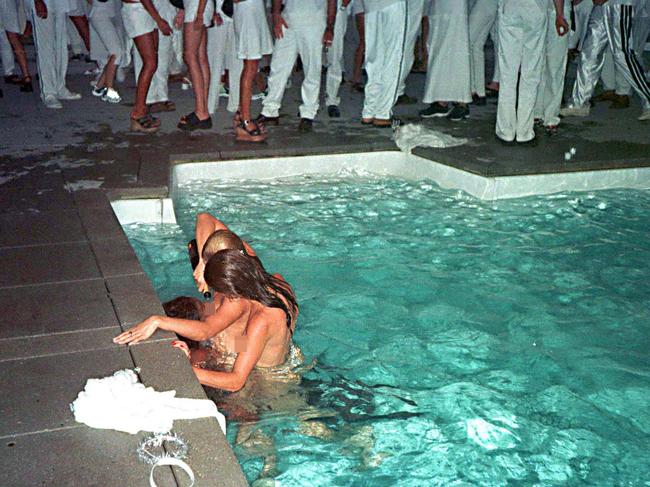 Topless women pour champagne on each other in a pool at Diddy’s Labor Day party in 1998. Picture: Globe Photos/Shutterstock