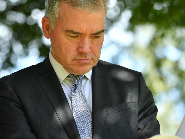 SA Health Minister Stephen Wade views his report out the front of the State Administration Centre, Adelaide. He is speaking on the release of Royal Adelaide hospital safety audit. Friday, March 23, 2018. (AAP Image/David Mariuz) NO ARCHIVING