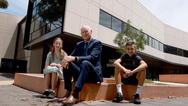 Brighton Secondary School principal Tony Lunniss with new year 7 students Scarlett Walters and Cooper Lawson. Picture: Kelly Barnes