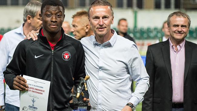 Croydon Kings' Hosine Bility wins the All Stars Cup's defender of the tournament in the Czech Republic in June receives from the honour from Jiri Valin a UEFA match agent. Pic: Supplied