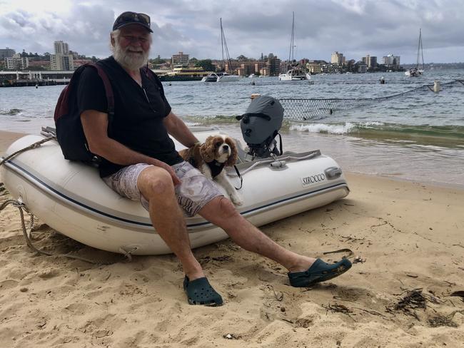 Yacht skipper Bruce Munro, with his dog Bailey, at the tidal pool on West Esplanade in Manly Cove on Monday. He reckons a pool with a deck that allow boaties to drop off and pick up people, would be a great asset in Manly Cove. Picture: Jim O'Rourke