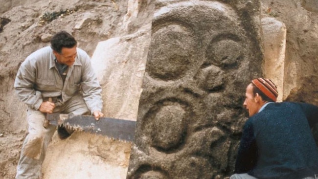 Tasmanian Aboriginal petroglyphs being cut from a cliff face at Preminghana in 1950. Picture: SUPPLIED