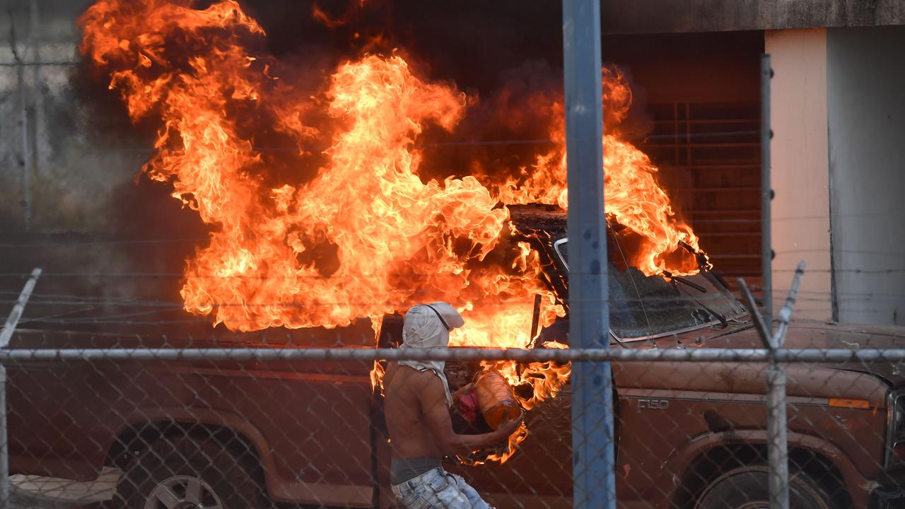 Harrowing images show vehicles set on fire during the clashes.