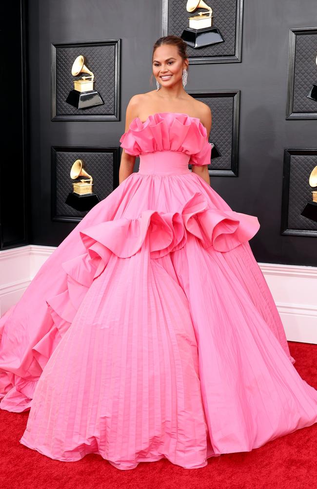 Pretty in pink! Chrissy Teigen. Picture: AFP