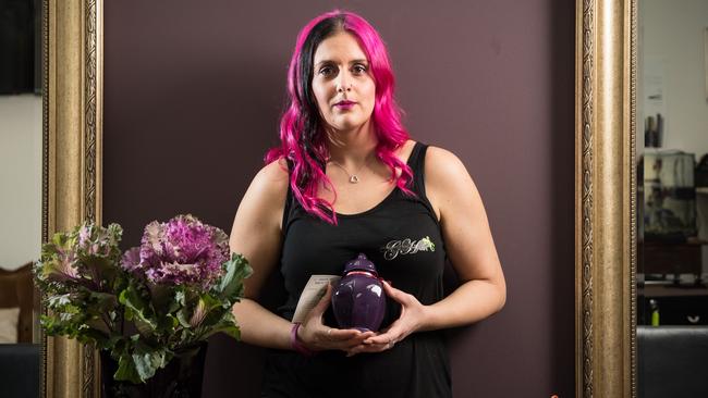 Stefania Nardone holding ashes of her bearded dragon Jose. Picture: Matt Turner