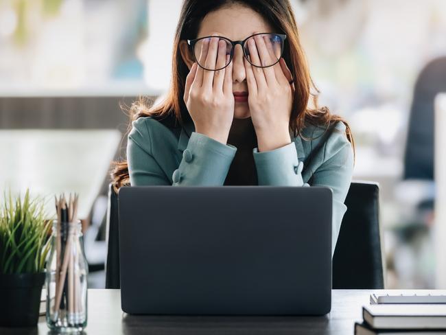 Concept Burnout Syndrome. Business Woman feels uncomfortable working. Which is caused by stress, accumulated from unsuccessful work And less resting body. Consult a specialist psychiatrist