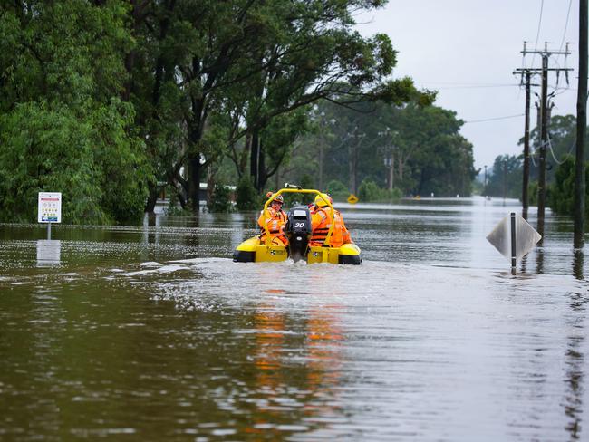 Major flooding in Windsor, Sydney where the bridge has been closed. SES Crews, Police and Fire Rescue Patrols are working together to load urgent medical supplies, food and other goods onboard the SES boats to be transported across the River to communities in need of help, in Sydney, Australia. Picture: NCA NewsWire / Gaye Gerard