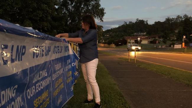 Polling booth worker Kirsten Jackson setting up for the LNP in a northern Gold Coast booth for the federal poll.