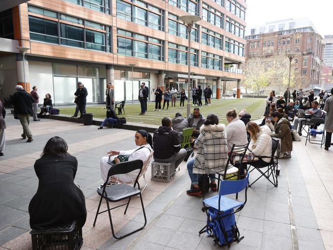 Pictured are people waiting in line outside the Sydney Passport Office before new measures were put in place to skirt gruelling waiting times. Picture: Tim Hunter