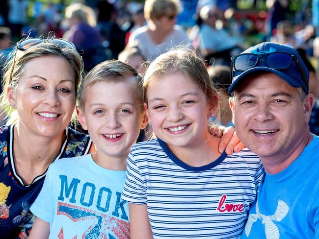 Justin and Fleur Peat with their kids Tamsin, 11, and Riley, 8, at Yarra Park. Picture: Jay Town