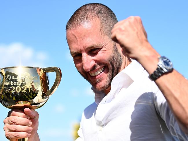 MELBOURNE, AUSTRALIA - NOVEMBER 02: Verry Elleegant owner Brae Sokolski poses with the Lexus Melbourne Cup after James Mcdonald rode #4 Verry Elleegant to victory in race 7, the Lexus Melbourne Cup during 2021 Melbourne Cup Day at Flemington Racecourse on November 02, 2021 in Melbourne, Australia. (Photo by Quinn Rooney/Getty Images)