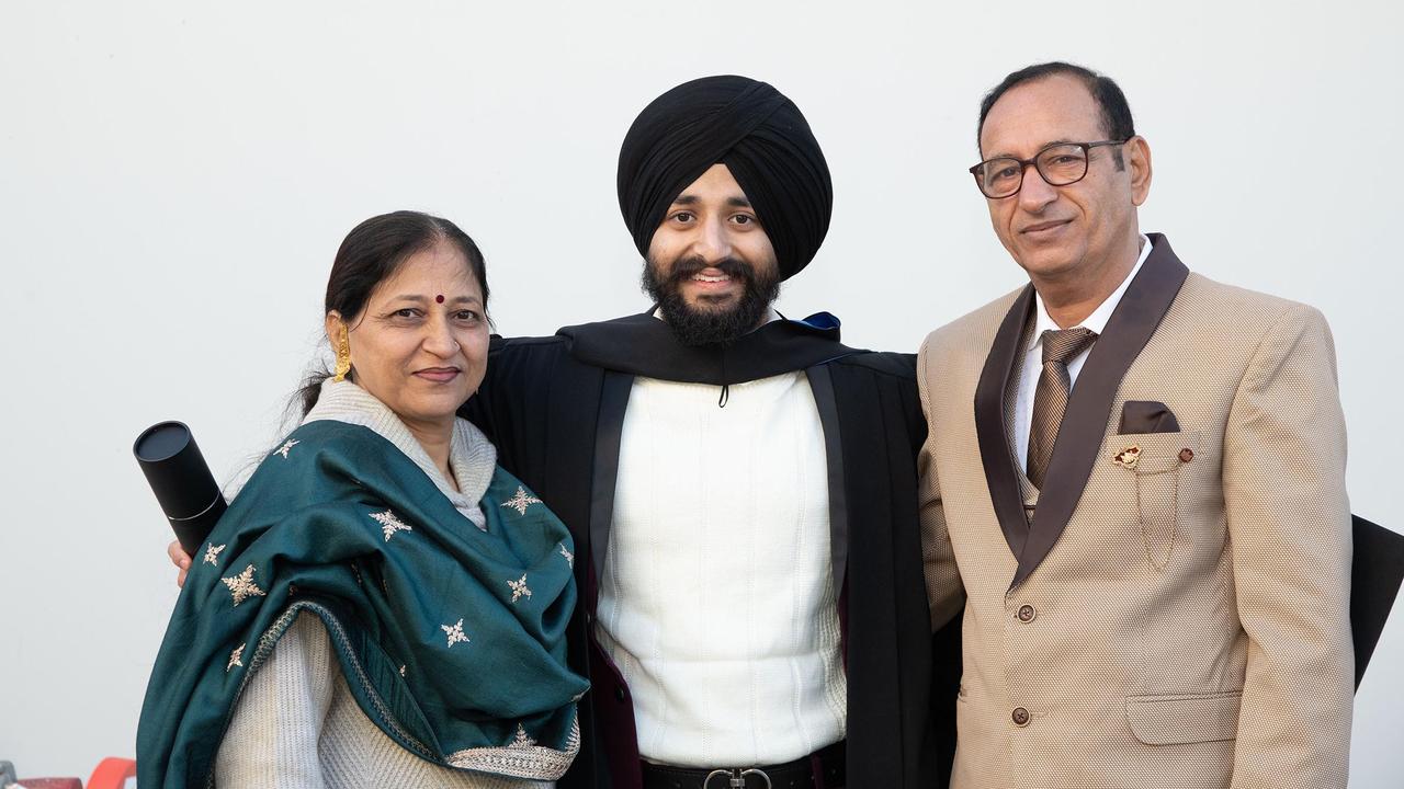 Bachelor of Nursing graduate Tajinder Pal Singh and his parents, Parvinder (left) and Amarjeet. UniSQ graduation ceremony at Empire Theatre, Tuesday June 27, 2023.