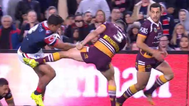 Latrell Mitchell gives James Roberts the big no thank you.