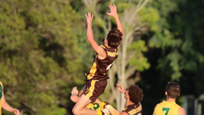 Nate Rowcliff flies high for Padua College in round 1.