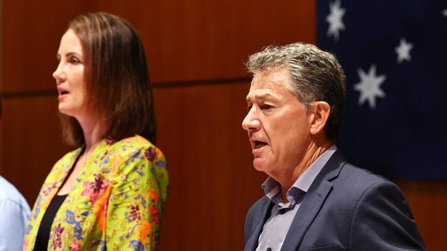 Cairns Regional Council mayor Amy Eden and chief executive Ken Gouldthorp sing the national anthem prior to an ordinary meeting in January. Picture: Brendan Radke