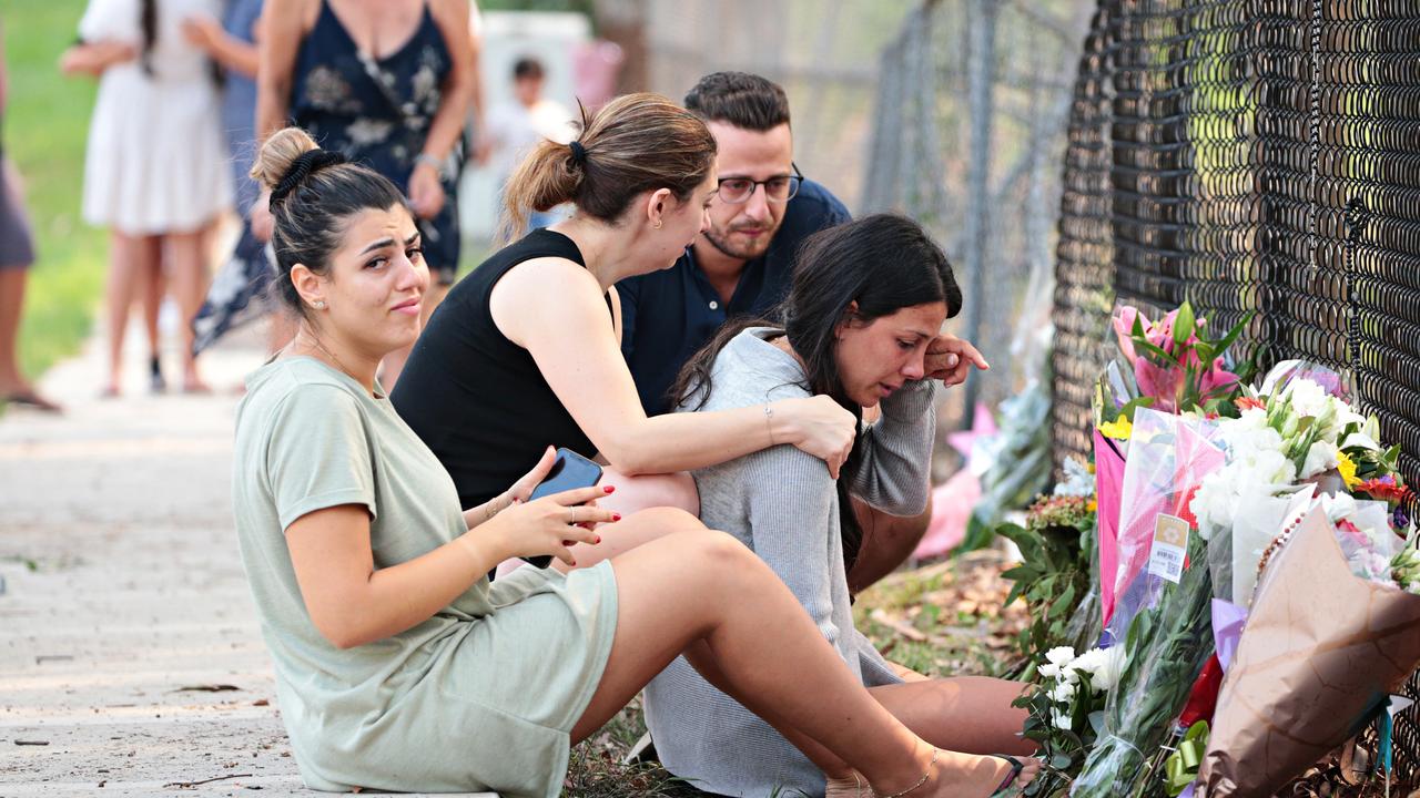 Leila Abdallah was comforted at the site of the crash. Picture: Adam Yip