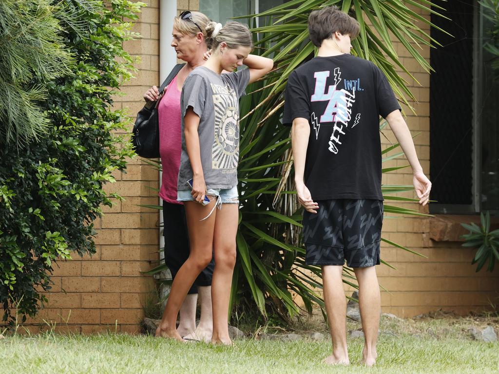 People attend the address at Iluka Avenue at Buddina where a boy was allegedly stabbed to death late on Thursday night. Picture: Lachie Millard