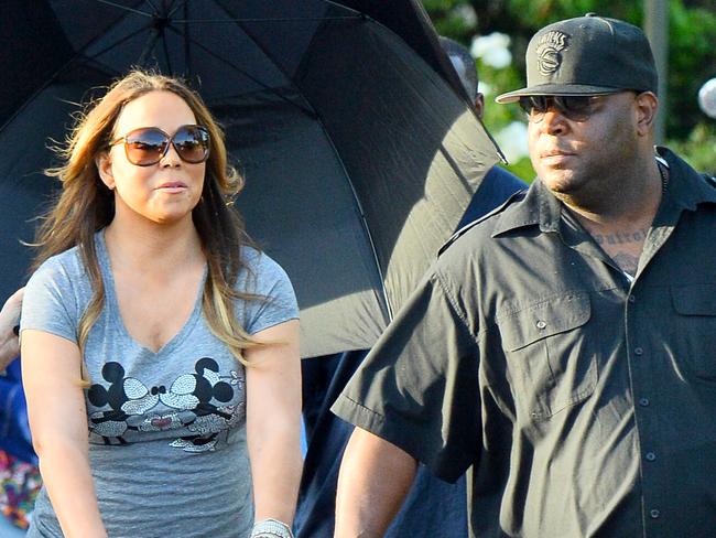 EXCLUSIVE: Mariah Carey spent the day at Disneyland and California Adventure with her two children Moroccan Cannon and Monroe Cannon at the happiest place on earth and brought along a very large entourage that included two nannies, four bodyguards, three disneyland VIP tour guides and a woman who acted as her umbrella carrier the entire day. The lady with the umbrella walked behind and around Mariah the entire day covering her from the sun. even as mariah rode rides this woman was always nearby. Mariah and her children enjoyed many rides throughout the day including toy story mania, a carousel, the dumbo ride, space mountain, the hollywood tower of terror and the star tours ride. Mariah also treated her children to a special lunch at Ariel's grotto where they were greeted by many of the characters fro the park including Ariel herself. Pictured: Mariah Carey, Monroe Cannon, and Moraccan Cannon Ref: SPL1031358 200515 EXCLUSIVE Picture by: Fern / Sharpshooter Images Splash News and Pictures Los Angeles: 310-821-2666 New York: 212-619-2666 London: 870-934-2666 photodesk@splashnews.com