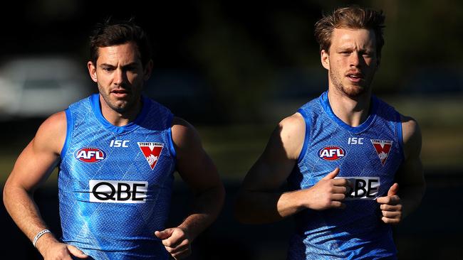 Callum Mills, right, with teammate Daniel Menzel at Swans training. Picture: Phil Hillyard