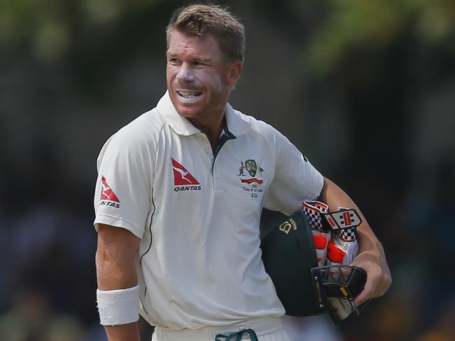 Australia's David Warner awaits for a third umpire decision before leaving the pitch on the third day of their second test cricket match against Sri Lanka in Galle, Sri Lanka, Saturday, Aug. 6, 2016. (AP Photo/Eranga Jayawardena)