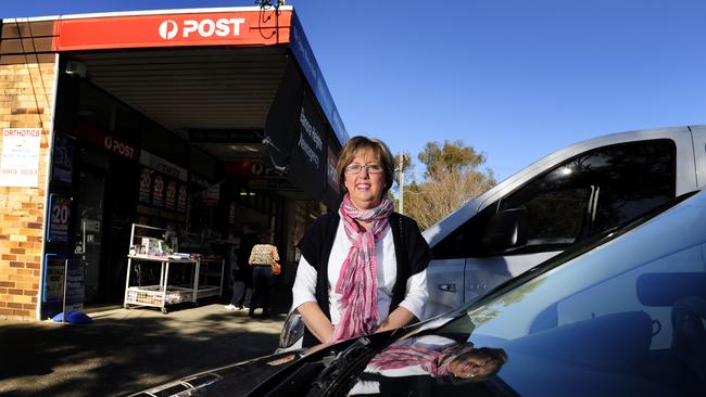 Karla Rothpletz-Tatt outside the Elanora Heights Newsagency and Post Office in 2012. She and husband Stephen Tatt are closing the business in July, after 24 years serving the community. Picture: Simon Cocksedge
