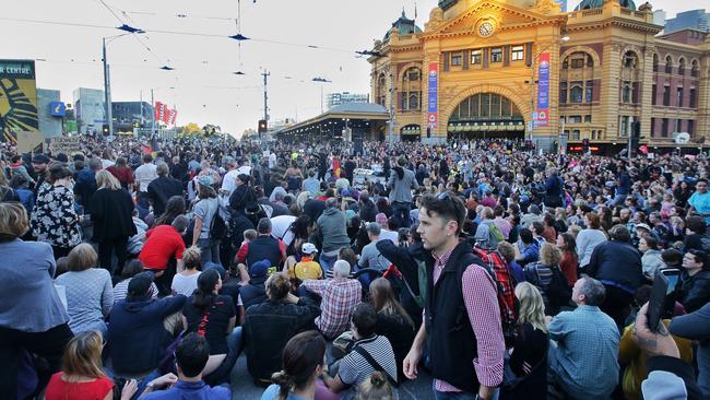 Protestors outside Flinders Street Station.