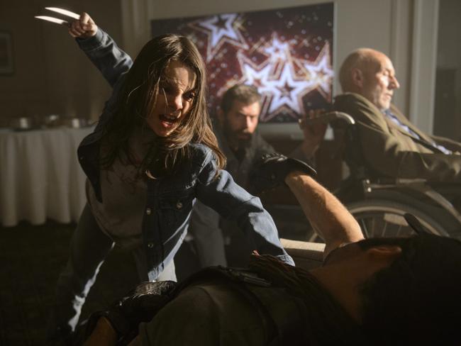 Dafne Keen’s Laura gets her claws out in a scene from Logan with Jackman and Patrick Stewart. Picture: Ben Rothstein / Twentieth Century Fox