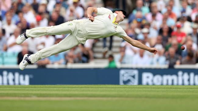 Pat Cummins dives to field the ball on day one of the fifth Ashes Test at The Oval. Picture: Getty Images