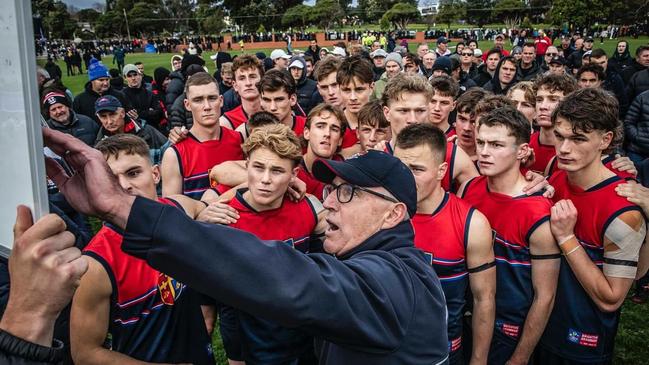 Simon McPhee (front) talks to his players against Haileybury. Picture: Brighton Grammar School