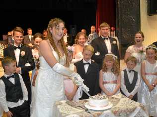 Calista Hanna officially cuts the debutante cake. Picture: Molly Hancock