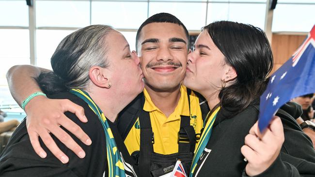 South Australian Olympic boxer Callum Peters with his mum Cassie and sister Lana Peters at Adelaide airport. Picture: NewsWire / Brenton Edwards