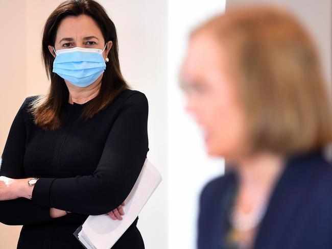 Queensland Premier Annastacia Palaszczuk watches Chief Health Officer Dr Jeannette Young. Picture: NCA NewsWire / Dan Peled