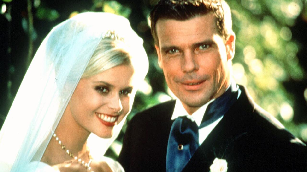 Harrison in a wedding scene with on-screen husband Graham Harvey on Neighbours.