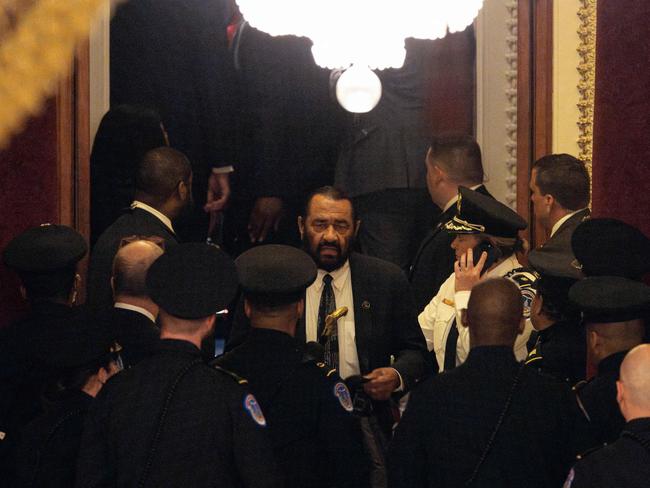 Green was is removed from the floor. Photo by Tierney L. Cross / GETTY IMAGES NORTH AMERICA / Getty Images via AFP