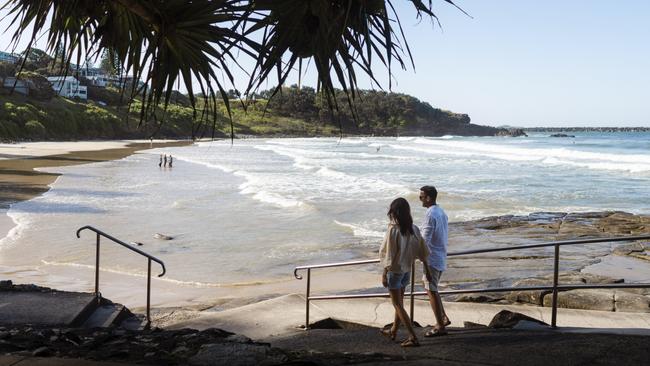 ESCAPE. 06 FEB, 2022. Couple enjoying a day out at Yamba Main Beach, Yamba. Picture: Destination NSW