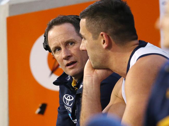 AFL Round 13. 16/06/2018. Hawthorn v Adelaide at the MCG.  Adelaide coach Don Pyke talks with skipper Taylor Walker on the bench during the 3rd qtr    . Pic: Michael Klein