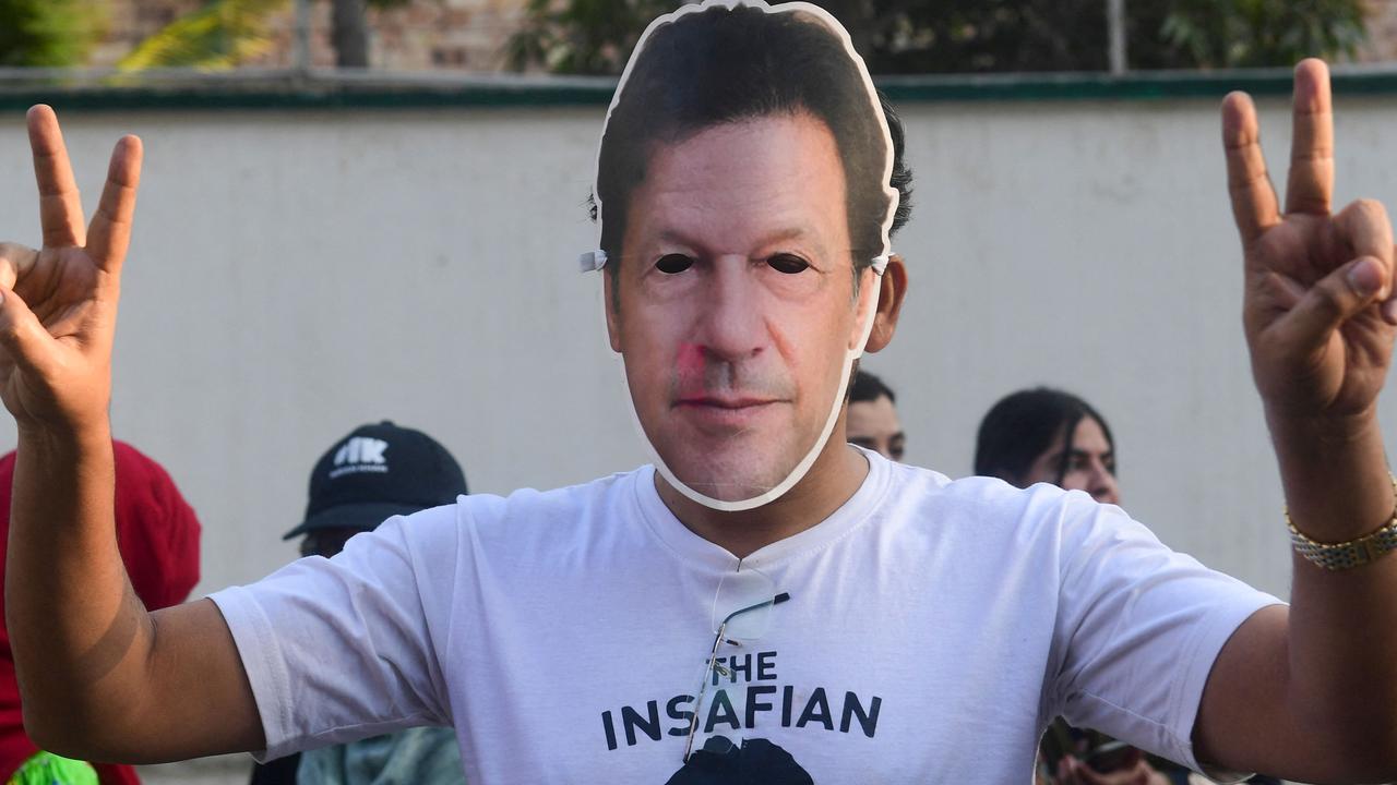 Imran Khan's Pakistan Tehreek-e-Insaf (PTI) party supporter wears Khan's mask while he protests against the alleged skewing in Pakistan's national election results, in Karachi on February 11, 2024. Picture: AFP