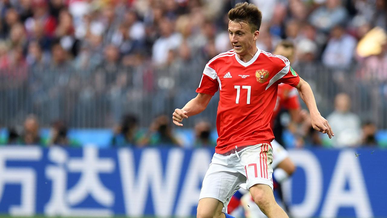 Russia's midfielder Aleksandr Golovin controls the ball/