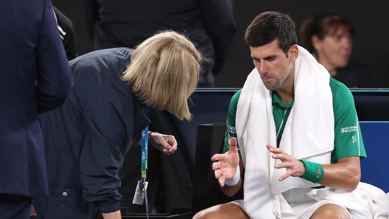 Novak Djokovic talks with a doctor during the third set. Picture: Michael Klein