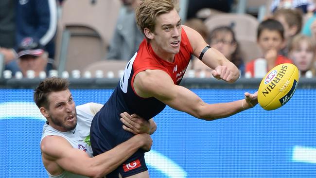 Dale Thomas tackles Oscar McDonald at the MCG.