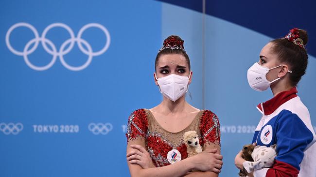 Russia's Dina Averina (L) reacts next to her sister Russia's Arina Averina