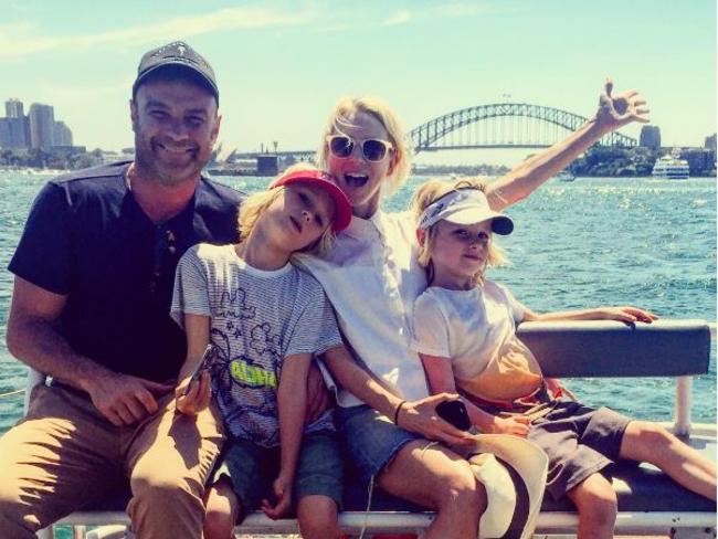 Happier times: Watts and her family on a day out on Sydney Harbour.