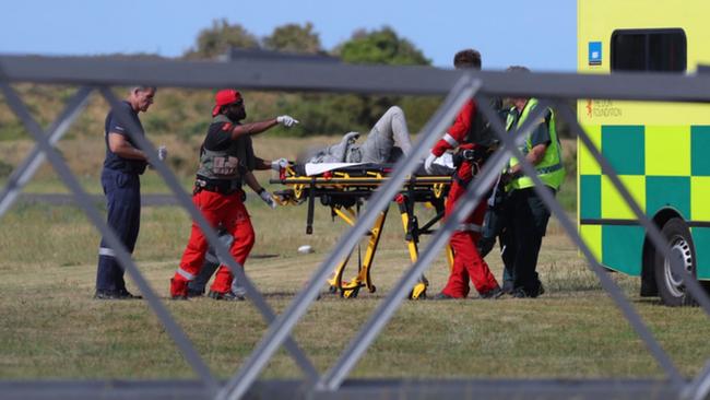 A person covered in ash arrives at Whakatane Airfield. White Island Island volcanic explosion. Picture: Alan Gibson