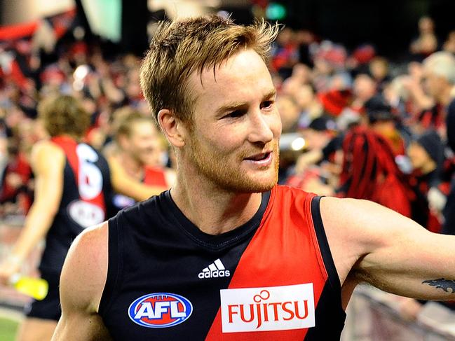 Jason Winderlich of Essendon celebrates with fans after the side's win, in the Round 14 AFL match between the Essendon Bombers and the Adelaide Crows at Etihad Stadium in Melbourne, Saturday, June 21, 2014. (AAP Image/Joe Castro) NO ARCHIVING, EDITORIAL USE ONLY