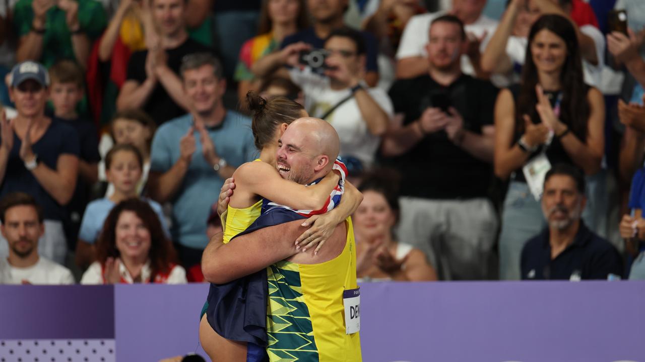 Women's pole vault gold medallist Nina Kennedy celebrates with Matthew Denny. Picture: Cameron Spencer/Getty Images