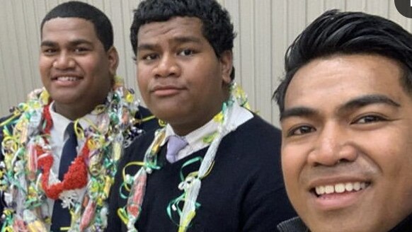 Solomone Taufeulungaki (centre) with his brothers.