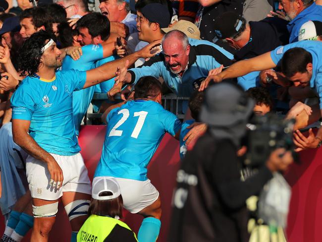 KAMAISHI, JAPAN - SEPTEMBER 25: Uruguay celebrate with friends and family after winning the Rugby World Cup 2019 Group D game between Fiji and Uruguay at Kamaishi Recovery Memorial Stadium on September 25, 2019 in Kamaishi, Iwate, Japan. (Photo by Koki Nagahama/Getty Images)