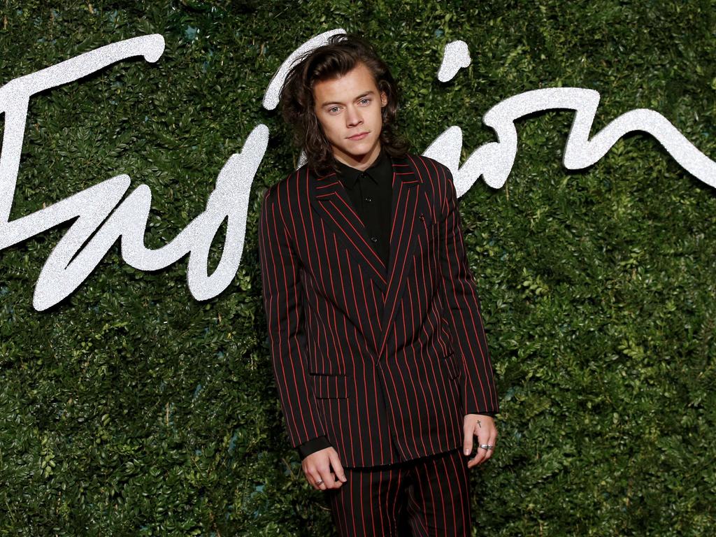 One Direction’s Harry Styles poses for pictures on the red carpet upon arrival to attend the British Fashion Awards 2014 in London on December 1, 2014. Picture: AFP