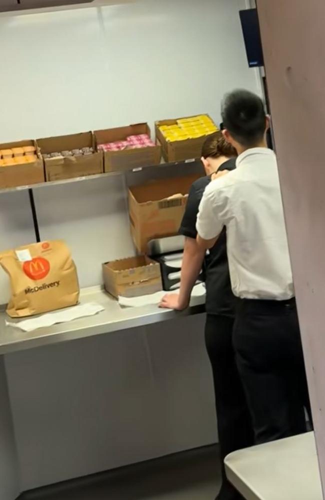 A Maccas manager has been caught massaging a female employee in front of customers. Picture: TikTok