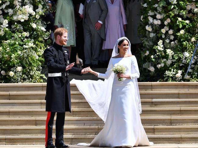 Britain's Prince Harry, Duke of Sussex and his wife Meghan, Duchess of Sussex outside the church. Picture: AFP PHOTO / Ben STANSALL